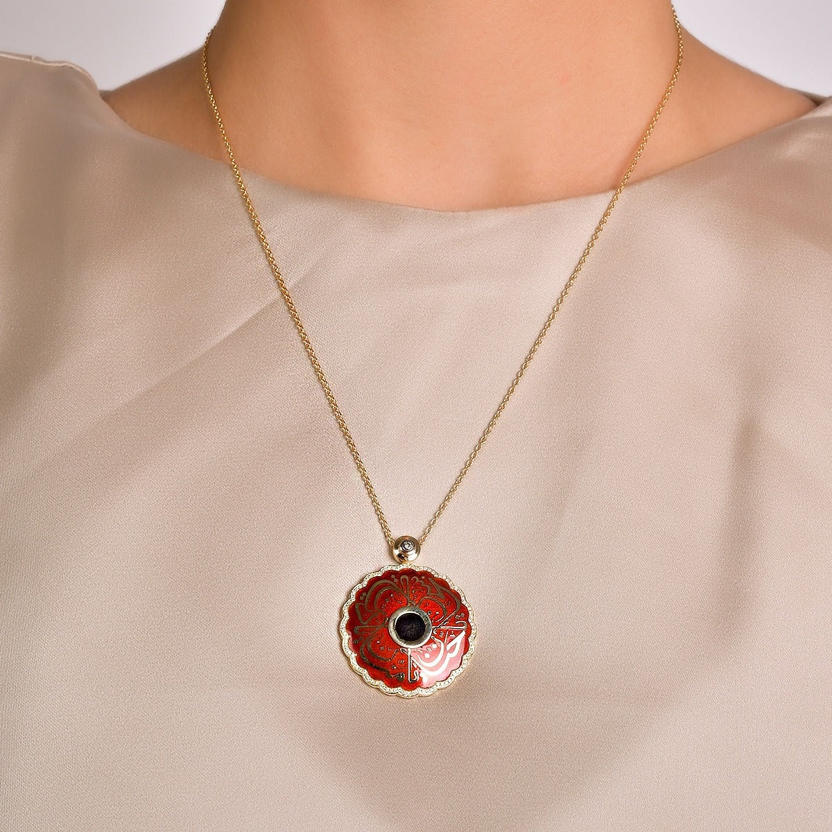 Necklace with a red pendant on a neutral background